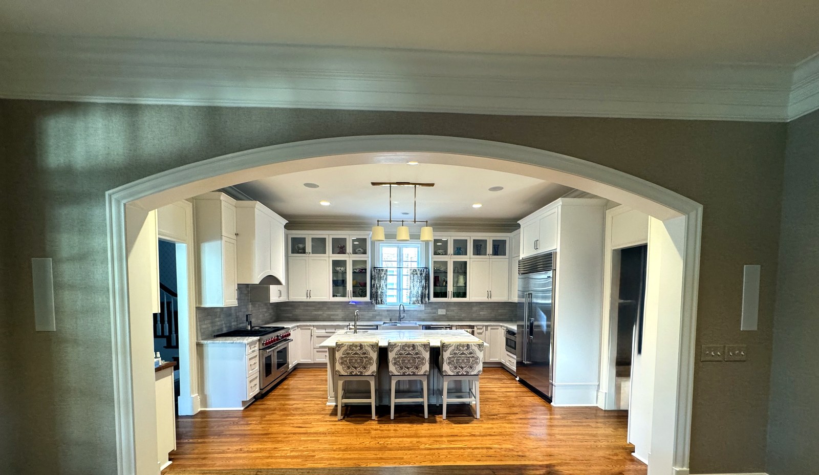 Kitchen viewed through an arched doorway